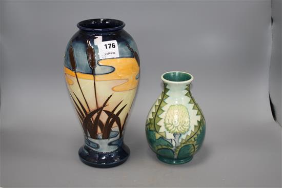 Two modern Moorcroft vases, one decorated with bulrushes and sunset, height 31cm, the other with stylised dandelions, height 19cm